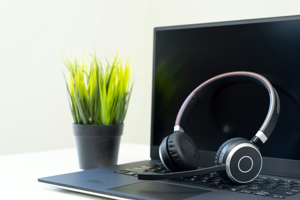 Headphone with laptop in office